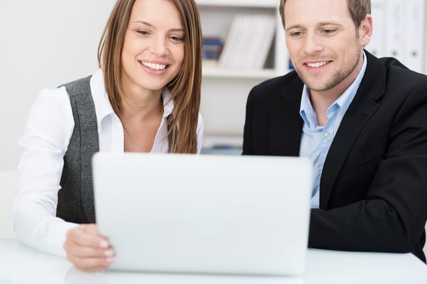 Woman and man with PC